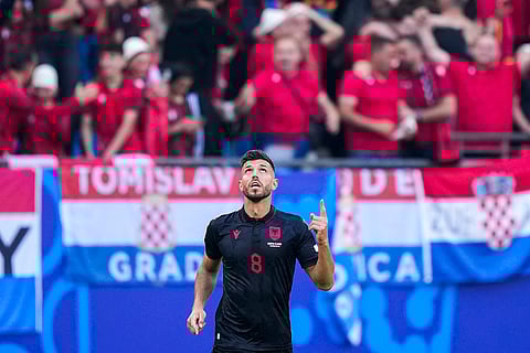Klaus Gjasula celebrates after scoring Albania's second goal